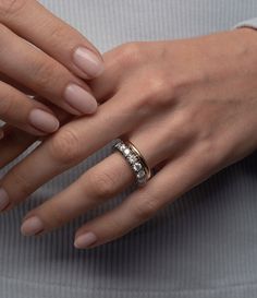 a woman's hand with a ring on it