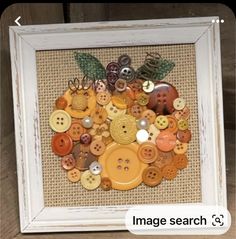 there is a picture frame with buttons in it