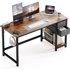 a computer desk with two computers on it