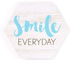 a wooden sign with the words smile everyday written in blue ink on top of it