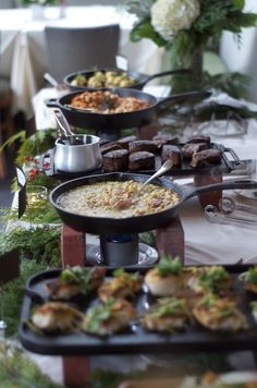 a buffet table with many different types of food on it