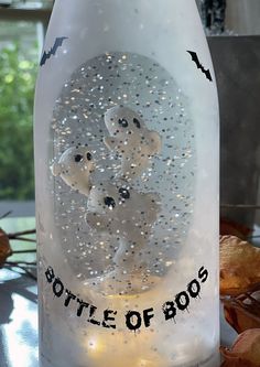 there is a bottle that has some lights in it and the words bottle of boos on it