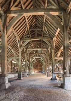 the inside of an old building with wooden beams