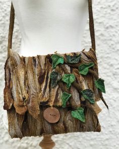 a purse made out of wood and leaves