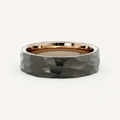 a men's wedding band in grey and rose gold