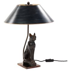 a cat lamp with a black shade on it's head and tail, sitting next to a white background