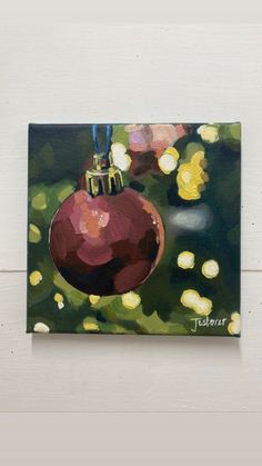 a painting of a christmas ornament hanging on a wall