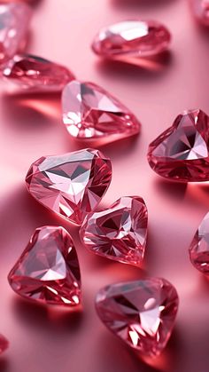 many pink diamonds are scattered on a pink surface