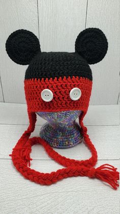 a crocheted hat with ears and eyes