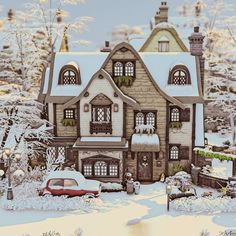 a house with snow on the ground and cars parked in front