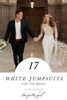 the bride and groom are holding hands while walking through an elegant hall with white jumpsuits