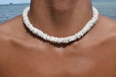 Elevate your summer style with our exquisite Natural White Clam Shell Puka Beach Summer Handmade Necklace. Perfectly crafted for men, women, and teens, this stunning accessory is more than just a necklace--it's a piece of paradise you can wear. Features: Authentic Clam Shell Puka Beads: Each necklace is handmade with natural white clam shell puka beads, ensuring unique variations and a genuine beachy feel. Versatile Design: The simple yet elegant design makes it a versatile piece, ideal for beach outings, summer festivals, or adding a touch of coastal charm to any outfit. Size Variations: Choose from a range of sizes, from chokers to longer lengths. Secure lock: We use a barrel/screw type lock, which is proven to be sturdier and have a cleaner look. Unisex Appeal: Suitable for men, women, Puka Necklace, White Shell Necklace, Chips Necklace, Puka Shell Necklace, Beach Necklace, Beach Anklets, Surfer Necklace, Beach Bracelets, Beach Necklaces