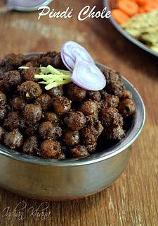 some food is in a metal bowl on a table