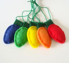 a bunch of small colorful objects hanging from a string