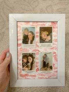 a hand holding a white frame with four pictures in it