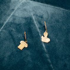 This mismatched pair of earring set is comprised of a shimmering rectangular bar along with two ancient statues of Hermès and a greek pillar. These tiny minimalist rectangular bar earrings have three colours of shimmering cubic zirconia stones in yellow, lavender and olive green colours. The rectangular bar, the Hermès statue as well as the ancient pillar are made from carefully polished 925 sterling silver. All parts are plated with gold finishing. Dimension of the rectangular bar Length: 15mm Width: 1.6mm Depth: 1.5 mm Dimension of the Hermès Statue Length: 15.7mm Width: 13.5mm Depth: 1 mm Dimension of the Ancient Pillar Statue Length: 13.3mm Width: 13.1mm Depth: 1 mm Materials Rectangular Bar: 925 Sterling sliver with gold plating Hermès Statue: 925 Sterling silver with gold plating Anc Hermes Statue, Green Colours, Ancient Statues, Mismatched Earrings, Olive Green Color, Wedding Jewelry Earrings, Bar Earrings, Pink Mini, 925 Sterling Silver Earrings