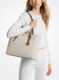 The Charlotte tote bag features a zippered closure that opens to reveal a roomy interior and removable crossbody pouch inside. Finished in our Signature Logo-print canvas, it adds polished style to a myriad of ensembles. Michael Kors Top Handle Bag For On-the-go, Michael Kors Bag With Top Carry Handle For On-the-go, Michael Kors Leather Bag For On-the-go, Logo Tote Bag, Michael Kors Leather Shoulder Bag With Silver-tone Hardware, Michael Kors Tote Shoulder Bag With Gold-tone Hardware, Polished Style, Michael Kors Crossbody Bag, Michael Kors Crossbody