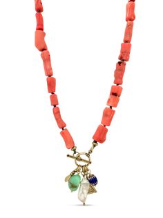 a necklace with beads and charms hanging from it