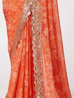 Be an angel and create and establish a smashing influence on every person by wearing this orange organza wedding wear saree. The designer, floral printed with sequin embroidery work and zari work appears to be chic and best for any occasion. This beautiful orange organza saree comes with a similar color blouse embellished with the same design as the saree. This cute orange wedding wear saree is 5.75 meters long and comes with fully unstitched 0.80 meters blouse material. Update your clothing sty Wedding Sharara With Printed Motifs, Orange Georgette Sharara For Navratri, Wedding Sharara With Printed Motifs In Georgette, Orange Sharara For Wedding, Sharara With Printed Motifs For Wedding And Navratri, Printed Motifs Sharara For Wedding And Navratri, Orange Georgette Sharara With Traditional Drape, Orange Georgette Sets For Festivals, Georgette Sharara With Cutdana In Orange