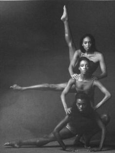 three women in black and white posing for a photo