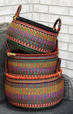 three woven baskets stacked on top of each other