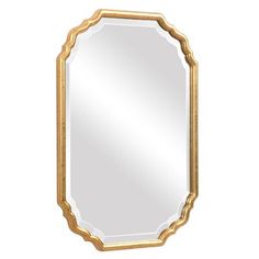 a gold framed mirror with an oval frame on the top and bottom edge, in front of a white background