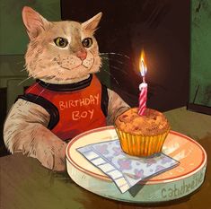 a cat sitting in front of a cupcake with a lit candle