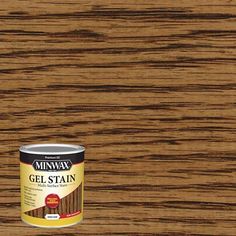 a can of minwax gel stain next to a wooden surface with the paint on it