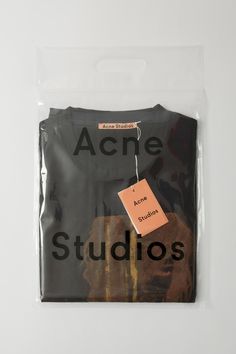 an acne shirt with the words acne studios on it