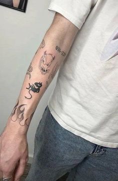 a man with a cat tattoo on his arm