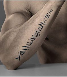 a man's arm with an arrow tattoo on the left side of his arm