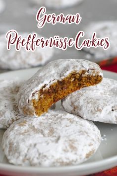 some powdered sugar cookies on a plate with the words german prefferusse cakes