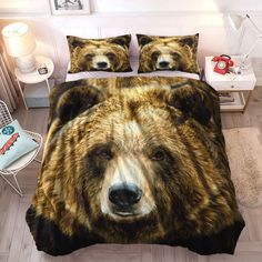 a bed with a brown and black bear on it's side, next to a night stand