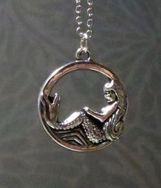 This gorgeous handmade necklace features a silver plated mermaid charm.  Product details Mermaid charm is silver plated; measures 1 inch approx. You may also choose charm only, no chain. If so, you will receive the charm on a matching silver ring. Check out more necklaces here: https://www.etsy.com/shop/AnEnchantingCreature?ref=seller-platform-mcnav&section_id=21978338  VISIT MY SHOPS HERE   * http://www.etsy.com/shop/HappyCatHouse * http://www.Etsy.com/shop/AnEnchantingCreature  CONNECT  * http://www.facebook.com/EnchantingCreature * https://instagram.com/enchantingcreature * https://www.pinterest.com/enchantingcreature * @EnchantingCreature  NEW TO ETSY?  A great tutorial to answer all of your questions about purchasing can be found here: http://www.etsy.com/help_guide_checkout.php  ABOU Mermaid Jewelry Necklaces, Mermaid Amulet, Gothic Mermaid Necklace, Silver Sterling Silver Mermaid Necklaces, Mermaid Locket, Mermaid Pendant, Silver Mermaid, Mermaid Gifts, Mermaid Necklace