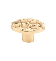 an image of a brass knob with rocks on the front and bottom, for cabinet doors