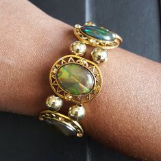 Green Jade color women's Bracelet. Elastic bandwith gold-filled metal spacer beads. Can be worn for any occassion. Gold Green Jewelry, Vintage Gold Stretch Bracelet With Round Beads, Vintage Gold Beaded Stretch Bracelet, Adjustable Gold Stretch Bracelet Vintage Style, Adjustable Gold Vintage Stretch Bracelet, Adjustable Gold Beaded Costume Bracelets, Adjustable Vintage Gold Stretch Bracelet, Gold Metal Stretch Bracelet With Round Beads, Gold Stretch Bracelet With Round Beads