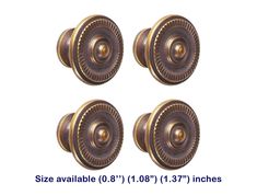 four antique style door knobs are shown