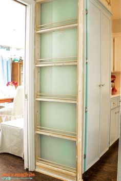 an empty bookcase in the corner of a room