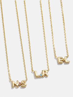 Commemorate special initials with our 18K Gold Double Initial Necklace. Two initials of your choice are spaced apart by a sparkling Cubic Zirconia birthstone. Opt to add your first and last initial or those of you and a loved one. Better yet? This necklace is crafted with 18K gold plated sterling silver. Gold Letter Pendants, Nameplate Necklace Gold, Nameplate Bracelet, Custom Initial Necklace, Gold Letter Necklace, Letter Earrings, Initial Earrings, 18k Gold Earrings, Nameplate Necklace