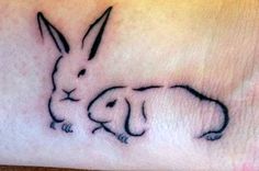 a small rabbit tattoo on the wrist