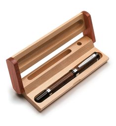 a wooden box with two pens in it and a pen holder on the inside that holds one