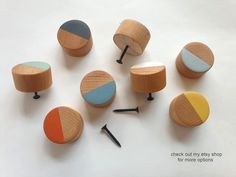 several wooden knobs with different colors on them