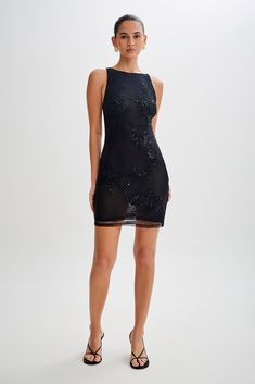 We just mesh well.Embrace elegance with the FALLON Embroidered Mesh Mini Dress, a captivating addition to your wardrobe. Boasting a high neck and open back design, this dress exudes sophistication with a hint of allure. The adjustable straps ensure a customised fit, while the mesh lining adds a touch of comfort. With its bodycon silhouette, it offers a flattering and sleek look for any occasion. Elevate your ensemble with the Fallon Embroidered Mesh Mini Dress, where every detail reflects timele Black Strap Heels, Mesh Mini Dress, Women Clothing Boutique, Sleek Look, Back Design, Ladies Boutique, Birthday Outfit, Strap Heels, Mini Black Dress