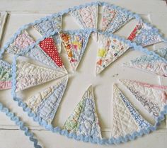 an image of a quilted doily on the floor with many different colors and shapes