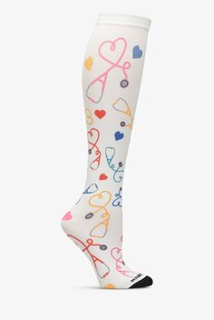 Treat your feet and legs to a little support. The light, gradient compression of Nurse Mates Stethoscope Hearts Women s Compression Socks is designed to help energize and soothe. Compression is greatest at the ankle, lessens gradually to the non-binding top band. Colorful, long-lasting print. One size fits most. • Nylon-stretch blend • Light compression: 12-14 mmHg • Gradient compression • Controlled pressure from the ankle up • Promotes better blood circulation • Reduces leg fatigue • Knee leng Nurse Essentials, Nurse Compression Socks, Nurse Socks, Light Gradient, Medical Shoes, Stethoscope Heart, New Nurse, Easy Stretches, Top Band