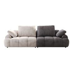 a gray and white couch sitting next to each other on top of a white floor