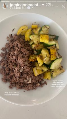 a white plate topped with meat and veggies