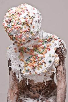 a woman covered in white frosting and sprinkles