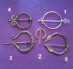 four different types of hair pins on a purple background