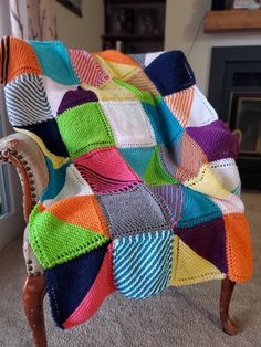 a colorful blanket sitting on top of a wooden chair